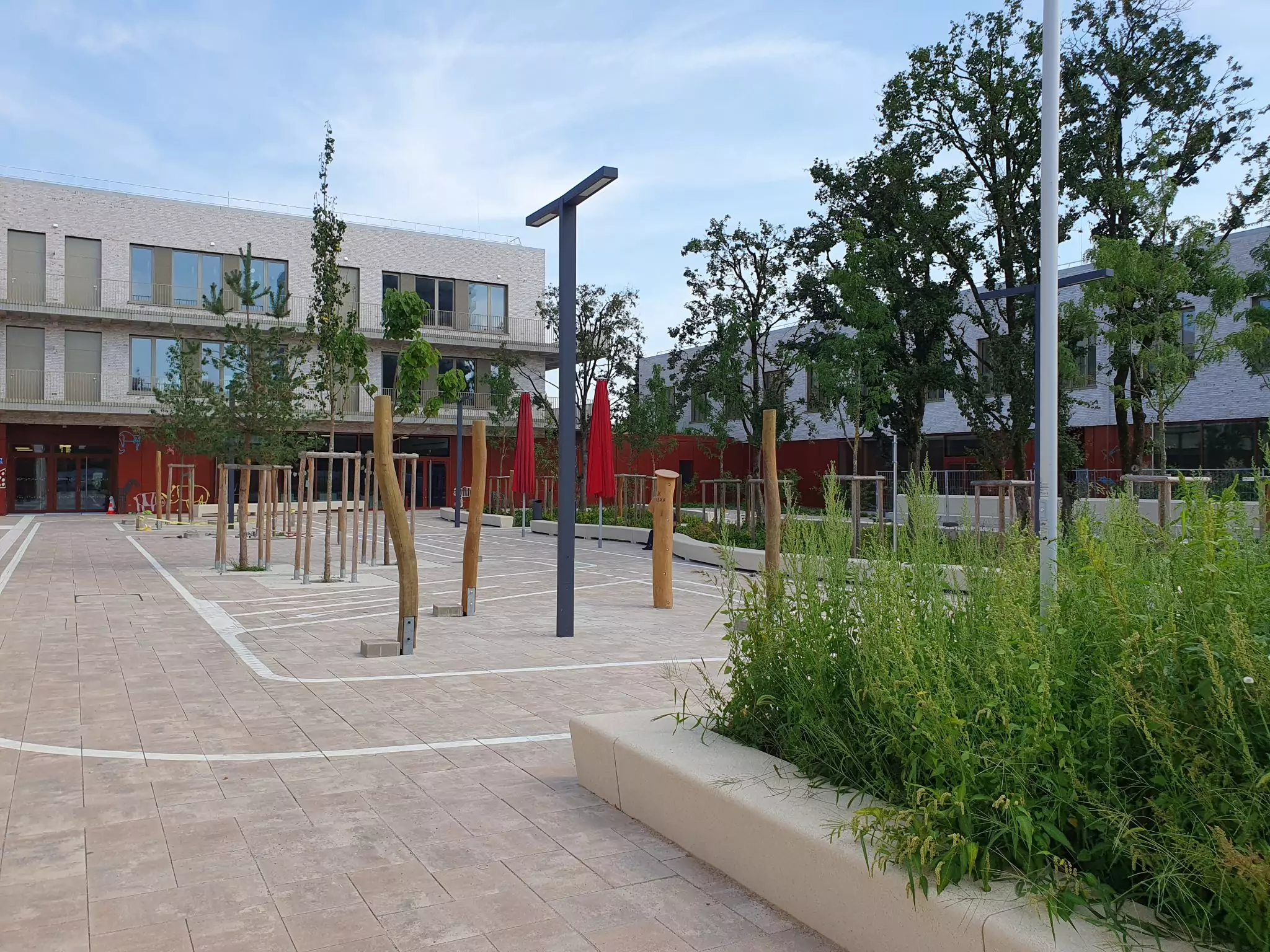 Grundschule mit Sporthalle, Tiefgarage und PV-Anlage München – Neubau